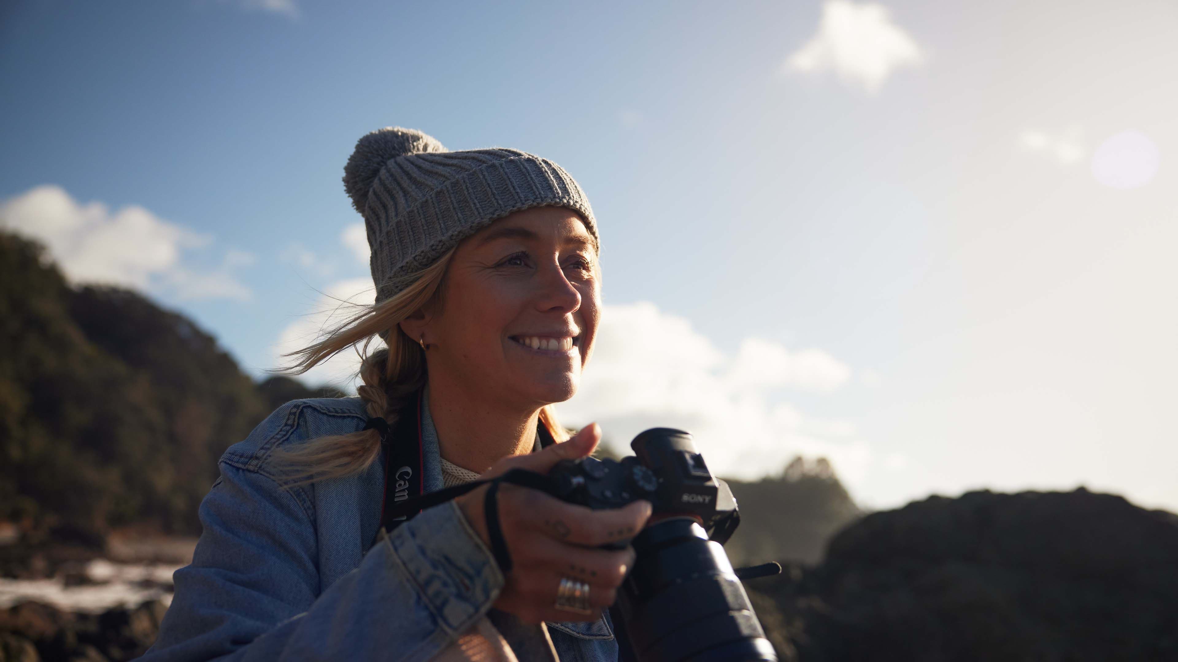 Girl holding camera about to take picture